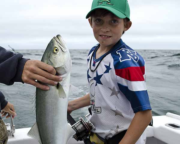 Kid on a Cape Cod fishing charter