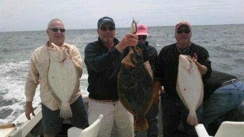 Group of men fishing for fluke on Cape Cod